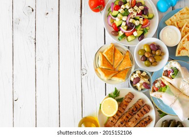 Greek Food Double Border, Overhead View On A White Wood Background. Buffet With Gyros Wraps, Souvlaki, Salad, Spanakopita And Pita With Tzatziki.