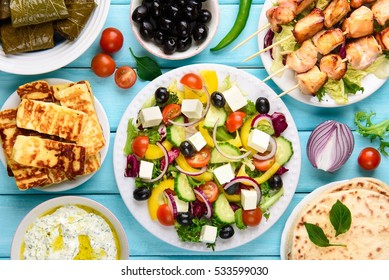 Greek food mix on a blue wooden background. Top view.  - Shutterstock ID 533599030