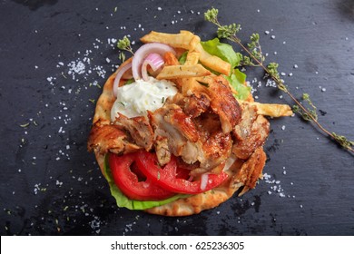 Greek Gyros Dish On A Black Plate - Top View