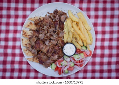 Greek Gyros And Salad And 
Potatoes And Tzatziki