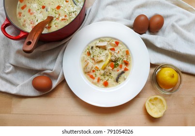 Greek Lemon Chicken Soup On Wooden Table