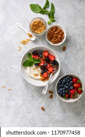 Greek Plain Yogurt With Fresh Berries Honey And Homemade Granola With Almonds, Overhead View, Space For A Text