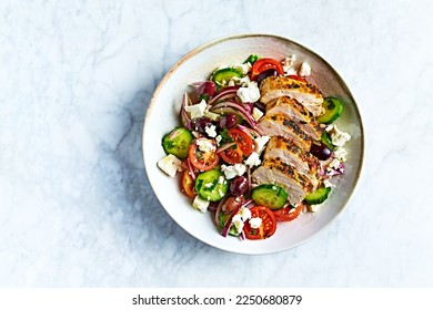 Greek salad with chicken. Top view. Copy space - Powered by Shutterstock