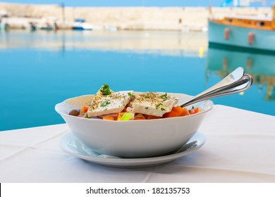 Greek Salad With Feta Cheese On A Table. Rethymno, Crete, Greece