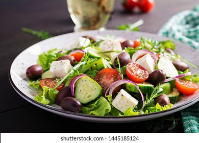 Greek salad with fresh vegetables, feta cheese and kalamata olives. Healthy food. - Shutterstock ID 1445185124