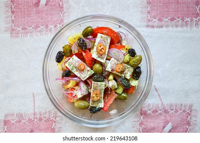 Greek Salad In The Glass Bowl On The Tablecloth, View From Above