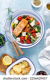 Greek salad with grilled salmon fish. Traditional mediterranean cuisine. Healthy food, diet. Top view - Shutterstock ID 2256429457