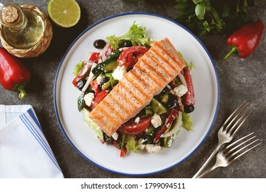 Greek Salad With Grilled Salmon. Healthly Food.