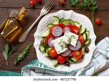 Greek Salad And Ingredients Top View On Wood