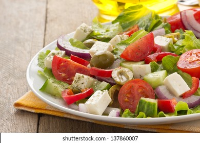 Greek Salad On Wood Background