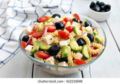 Greek Salad With Pasta On White Background.