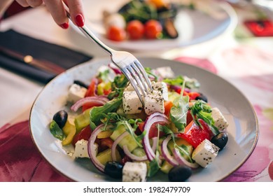 Greek Salat With Olives And Cheese With Fork