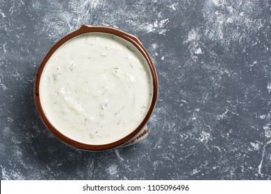 Greek Sauce Of Tzatziki On A Gray Background. The View From Above, Flat Lay