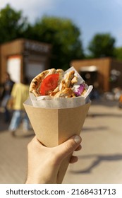 Greek Street Food Gyros In Hand. Greek And Mediterranean Cuisine With Meat In Pita.