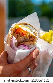 Greek Street Food Gyros In Man Hand Outdoor