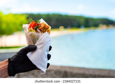 Greek Street Food Gyros In Man Hand Outdoor