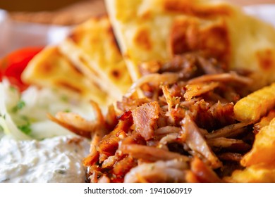 Greek Street Food Meal With Kebab Meat, Pita Bread And White Youghurt Served In Fastfood Restaurant For Takeaway.Download Royalty Free Curated Images Collection With Foods For Design Template