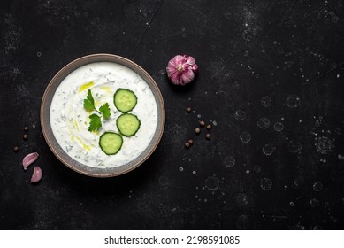 Greek Tzatziki Sauce On Black Stone Background. View From Above, Flat Lay