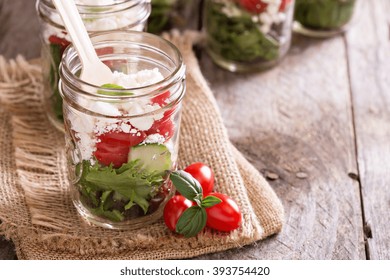 Greek Vegetable Salad In A Mason Jar With Feta Cheese