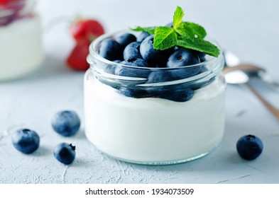 Greek yogurt blueberry parfaits with fresh berries. toning. selective focus