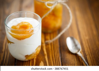 Greek yogurt with canned apricots in a glass 