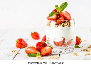 Greek yogurt with fresh strawberry and granola. Parfait. - Shutterstock ID 1889992300