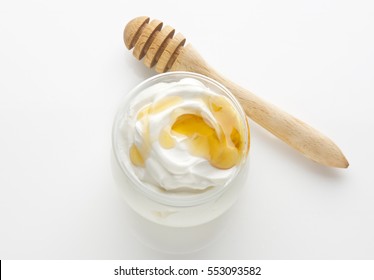 Greek Yogurt With Honey, Top Down View, Isolated On A White Background