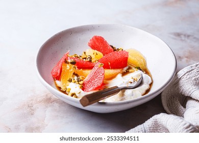 Greek yogurt with nuts and citrus slices. Diet breakfast concept. - Powered by Shutterstock