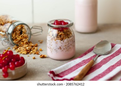 Greek Yogurt Parfait Dessert With Red Currant And Granola In Mason Jar