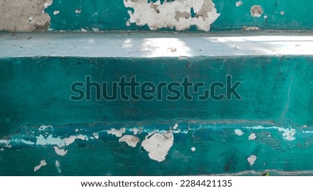 Green Abstract, old distressed brick wall Brick material, urban tile surface, colorful, old, deteriorated with time. Green weathered plaster cement mortar. abstract pattern background