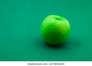 green apple with green background