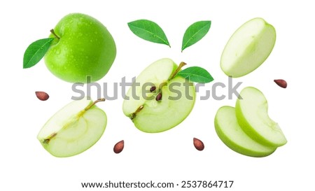 Green apple with leaf and slices pattern isolated on white background. Group flying apple movement. Clipping path.