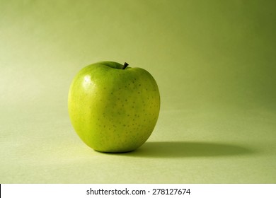 Green Apple On Green Background