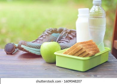 Green Apple,bread,protein Shake And Water On Table.Food For Runner Concept.