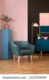 Green Armchair In Colorful Living Room Interior With Pink Phone On Navy Blue Cabinet