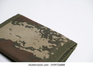  Green army decoreated wallet for mendotary military service. White background. selective focused photos. isolated. empty space for text. - Shutterstock ID 1939726888
