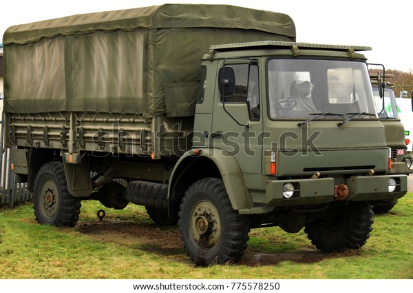 green army truck parked up with army supplies no\
people stock image stock\
photo