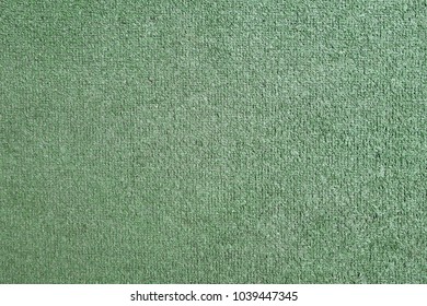 Green Artificial Grass Carpet For Cleaning Shoes Before Entering The Residence, Old Carpet Texture Background, Flat Lay Close-up Top View