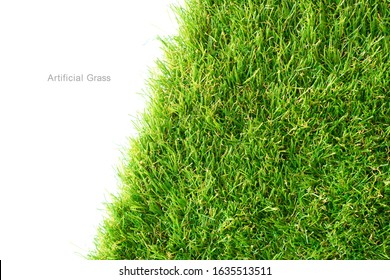 Green artificial grass on a white background, copy space. 