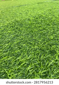 Green Artificial Grass Texture Background with Fresh Synthetic Turf Pattern