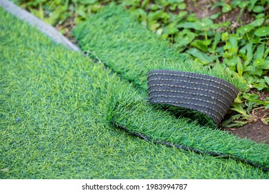 Green Artificial Turf Used For Covering Sport Arena Or Garden. Artificial Grass Are Made By Polyethylene Or Nylon, Convenient And It Does Not Require Much Maintenance.