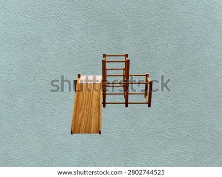 The green background in the image is a sturdy, brown wooden slide that can be disassembled into pieces. It's a toy slide for young children to play on in parks or gardens.
