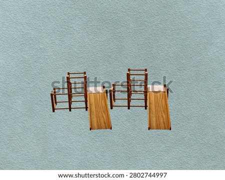 The green background in the image is a sturdy, brown wooden slide that can be disassembled into pieces. It's a toy slide for young children to play on in parks or gardens.
