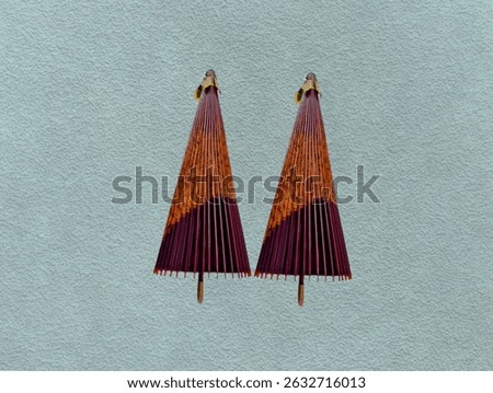 The green background in the picture is an umbrella decorated with a bamboo frame used to protect from the sun The colorful pattern is decorated with good quality paper that is durable and has beautif.