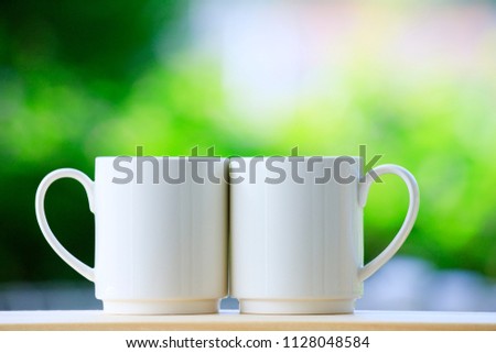 Green background and two mugs
