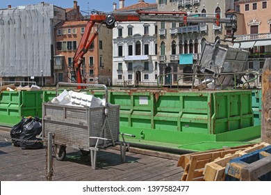 Green Barge With Crane for Transport Garbage and Recycling in Venice