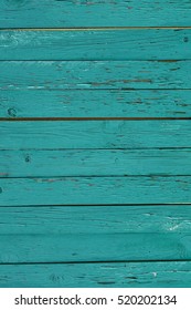 Green Barn Wooden Planking Wall Vertical Texture. Old Retro Wood Slats Rustic Shabby Background. Painted Wood Planking Peeled Weathered Surface. Dark Green Barn Wood Wall Shabby Background Texture 