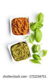 Green Basil And Red Tomato Pesto Dip Sauce  And Basil Leaves Isolated On White Background.