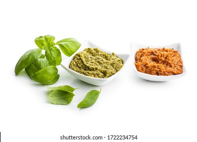 Green Basil And Red Tomato Pesto Dip Sauce  And Basil Leaves Isolated On White Background.