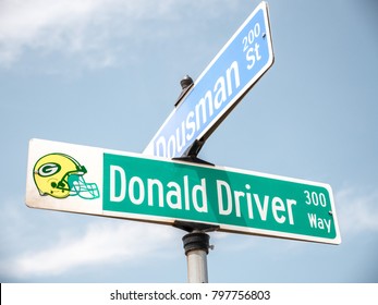 Green Bay - June 3rd 2017:  Looking Up At The Green And Gold Donald Driver Way Road Sign At The Intersection Of Dousman Street In Green Bay Wisconsin The Home Of The Packers NFL Football Team.